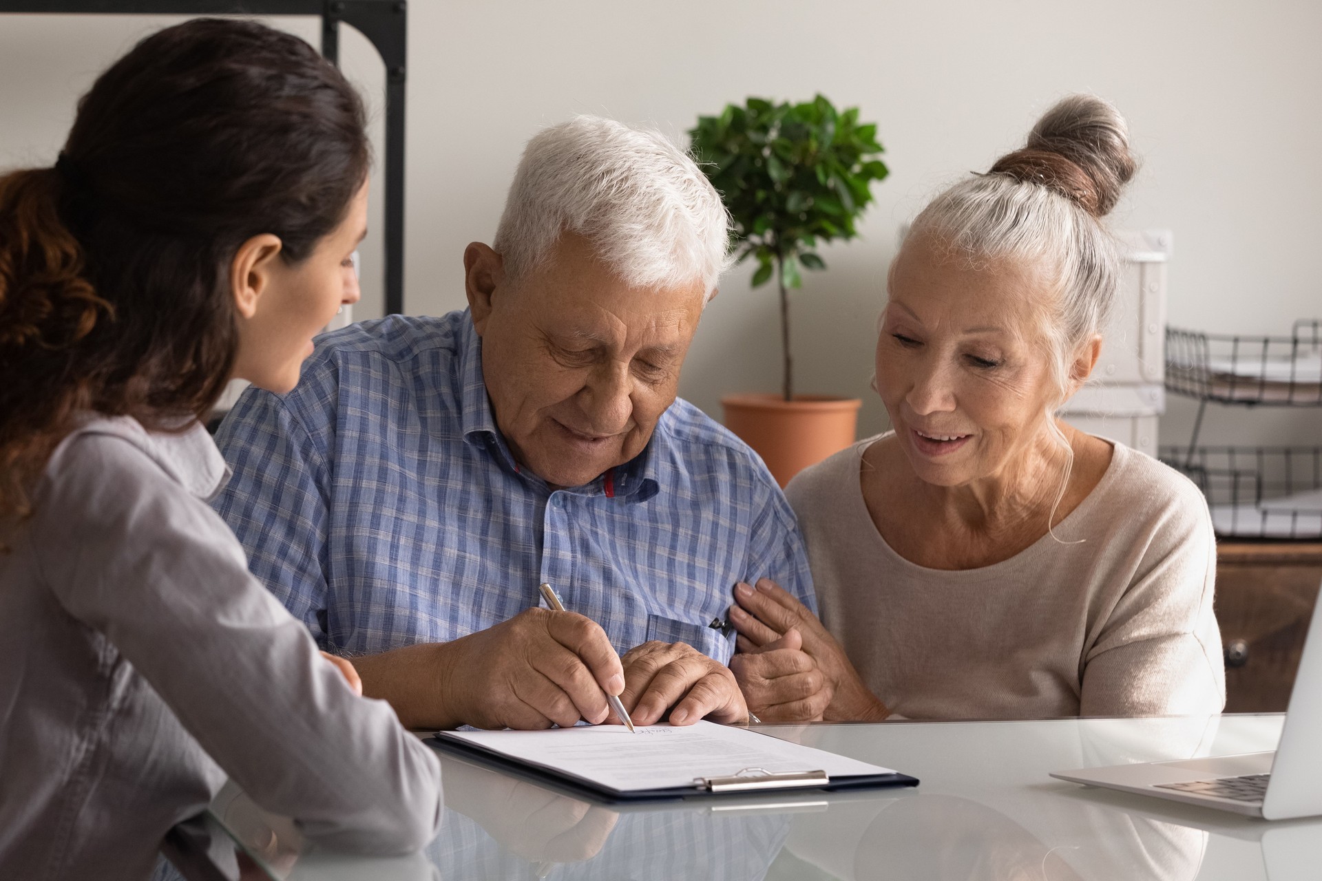 Retired spouses sign paper contract with help of professional agent